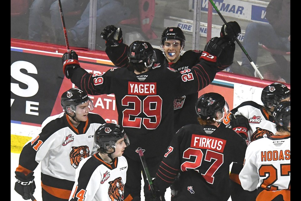 Logan Doust celebrates an apparent goal with Brayden Yager, but the puck was ruled to be kicked in.