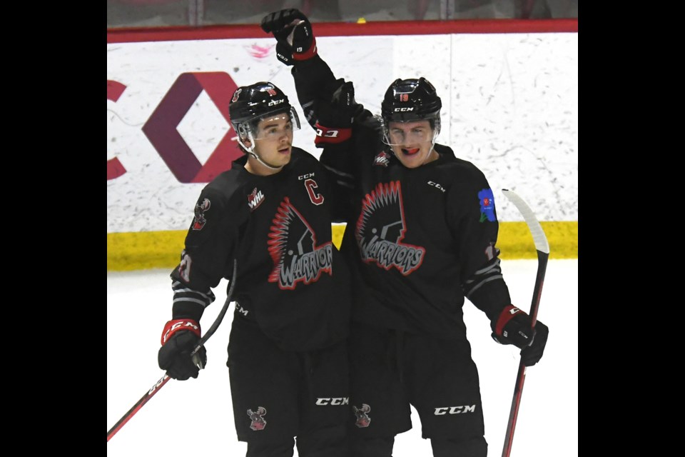 Warriors forward Martin Rysavy celebrates a goal with captain Daemon Hunt.