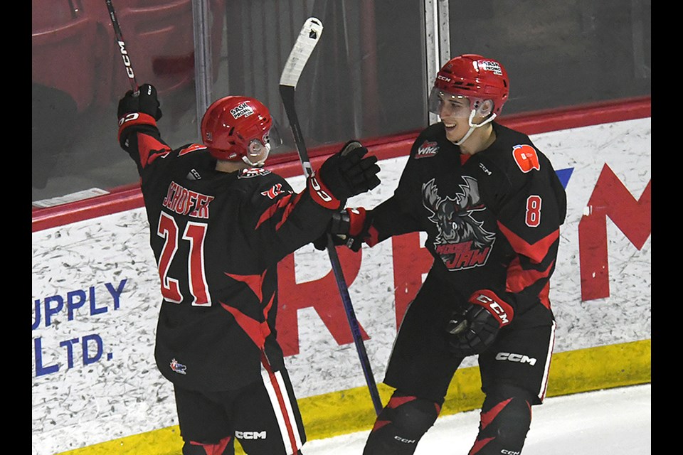 Eric Alarie celebrates with Tate Schofer after scoring the Warriors’ second goal.