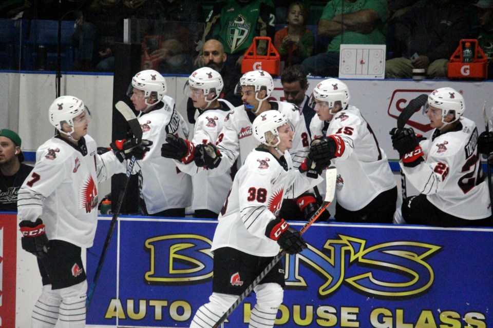 Ryder Korczak celebrates his game-opening goal with the Warriors bench. Lucas Punkari/Prince Albert Daily Herald photo