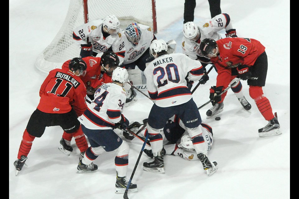 It was all hands on deck as the Warriors and Pats battled for the puck in front of Regina's net. Randy Palmer photograph