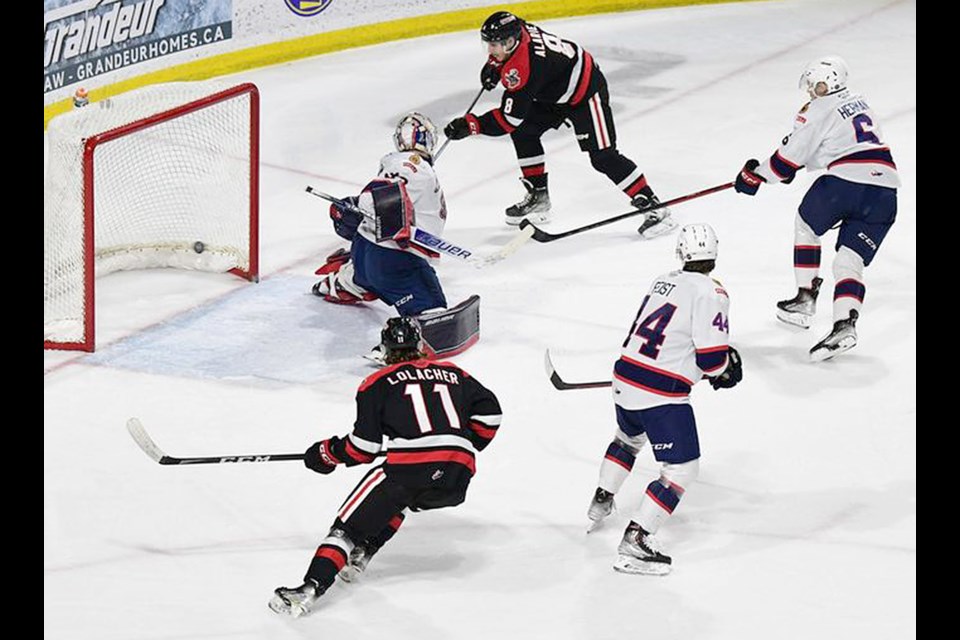 Eric Alarie scores the Warriors’ fourth goal of the game.