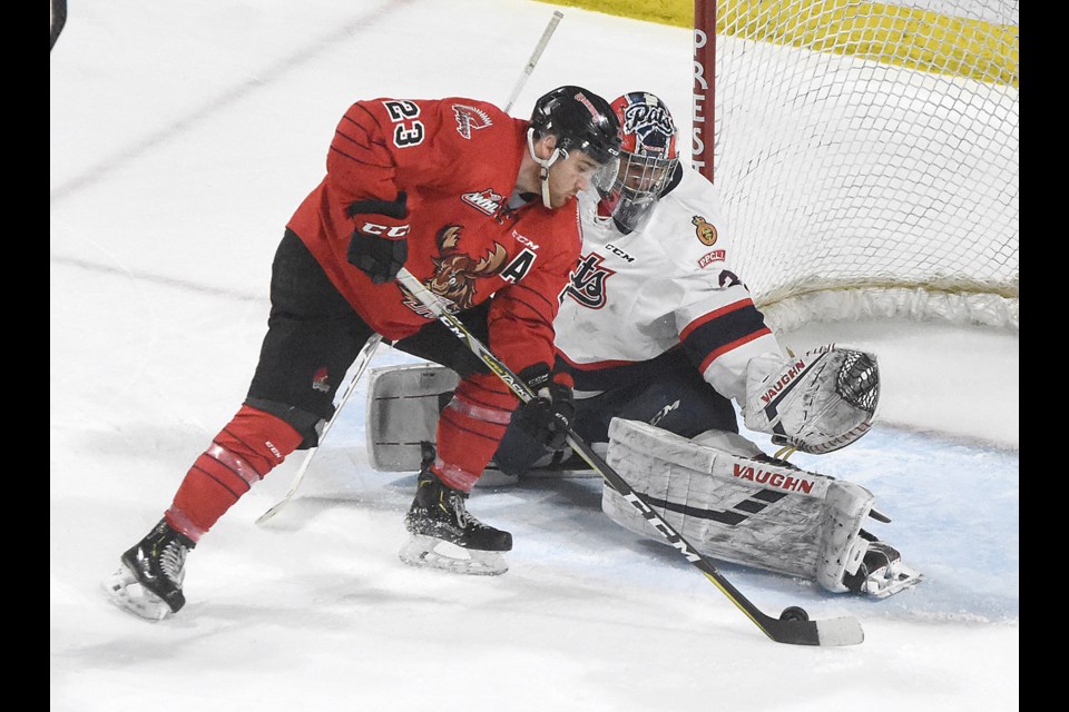 Moose Jaw Warriors forward Tristin Langan has Regina Pats goaltender Max Paddock at his mercy...