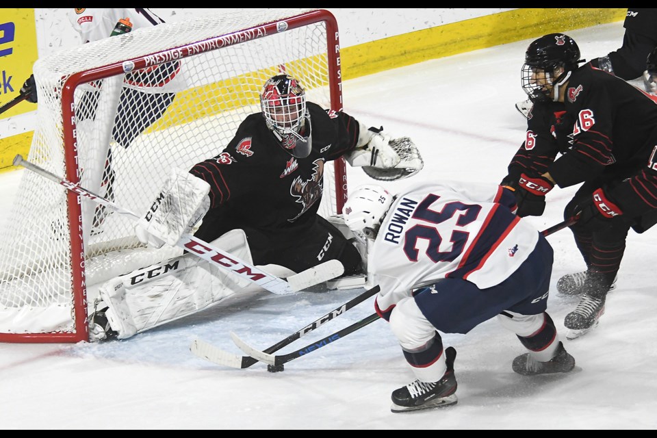Moose Jaw goaltender Carl Tetachuk gets across the net to make an outstanding save on Regina’s Zane Rowan.