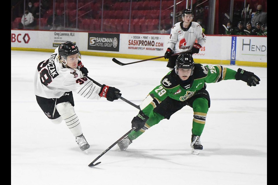 Ryder Korczak gets off a shot during a second-period power play for the Warriors.