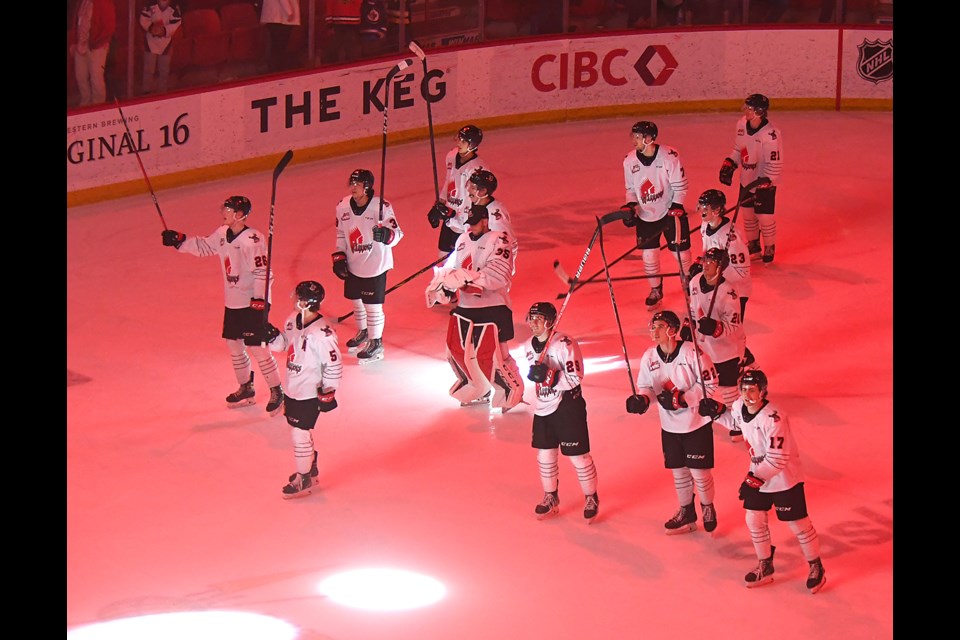 The Moose Jaw Warriors salute the fans after their overtime win over the Red Deer Rebels on New Years Eve.