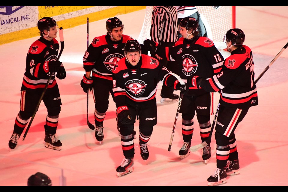 Martin Rysavy (centre) prepares to lead the fly-by after scoring his first-period goal.