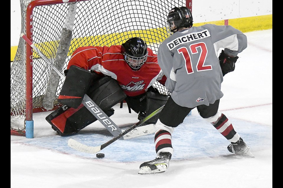 Moose Jaw Minor Hockey product and Warriors prospect goes in on goaltender Micah Davidson during the rookie scrimmage shootout.