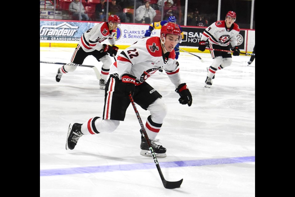Warriors forward Josh Hoekstra leads the rush up ice during second period action.