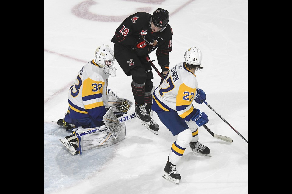 Martin Rysavy takes to the air as a shot from the point on Ethan Chadwick goes wide of the net