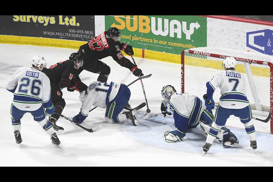 Moose Jaw Warriors defenceman Libor Zabransky jumps up into the play and gets off a shot at the side of the net…