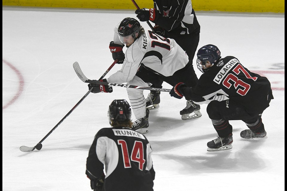 Bryden Kiesman battles his way through traffic in the offensive zone.