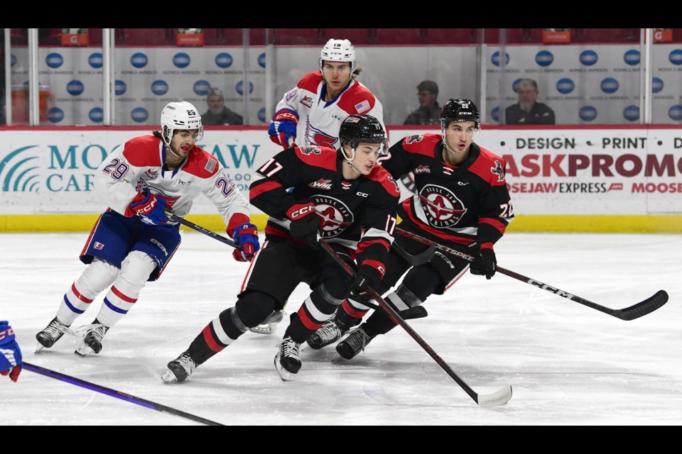 Lynden Lakovic (17) and Josh Hoekstra break into the Spokane zone.