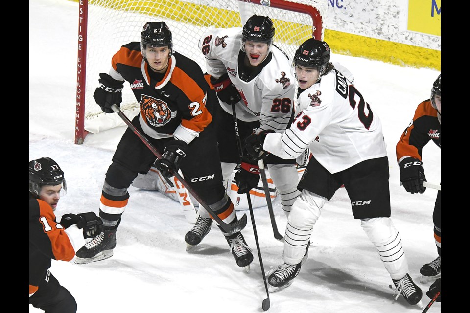Warriors forwards Nathan Pilling and Atley Calvert had a pretty good screen going on Tigers goaltender Beckett Langkow during second-period action.