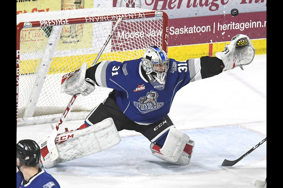 Victoria Royals and former Moose Jaw Warriors goaltender Adam Evanoff offers at a puck going wide of the net.