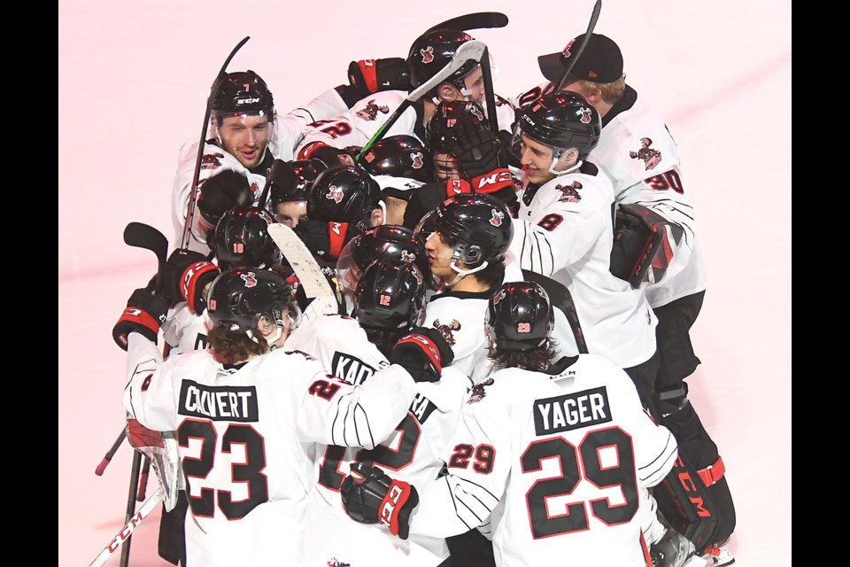 The Moose Jaw Warriors celebrate after their shootout win over the Winnipeg Ice.