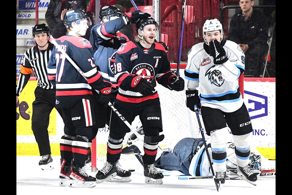 Ryder Korcak (centre) celebrates after the Warriors' first goal of the game.