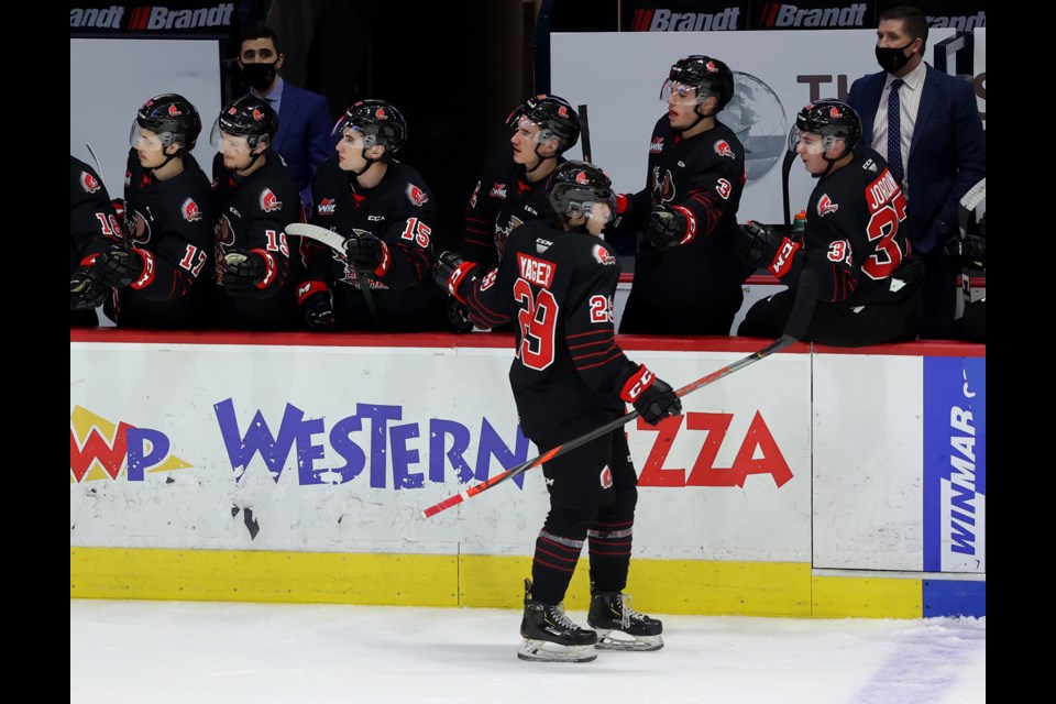 Brayden Yager does the flyby of the bench after scoring the first goal of his WHL career on Tuesday against Regina. Keith Hershmiller photo