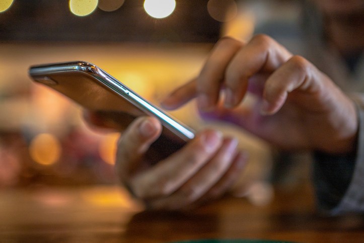 man using a smartphone stock