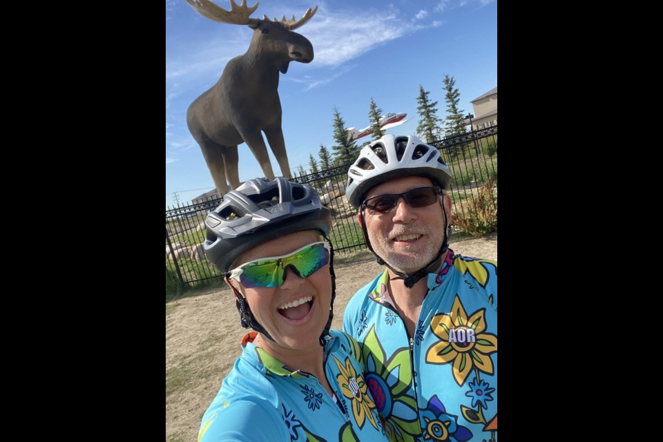 Lady JB Owen (left) and her husband (right) stop in Moose Jaw during their 2020 cross-Canada cycling trip.