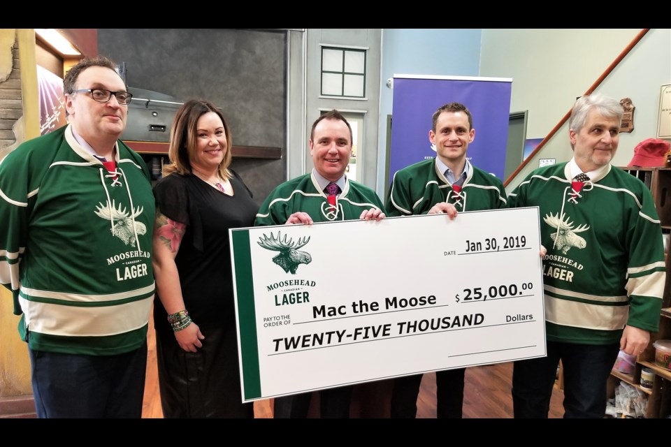 Moosehead Breweries presents its donation of $25,000. (Sasha-Gay Lobban photograph)