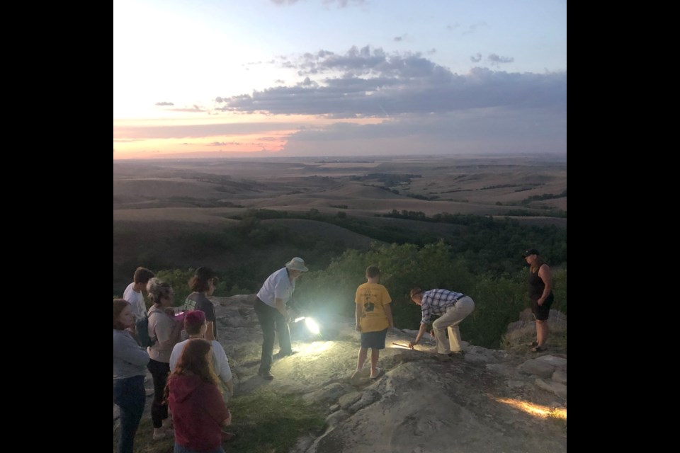 A tour of the petroglyph site. Photo courtesy Facebook