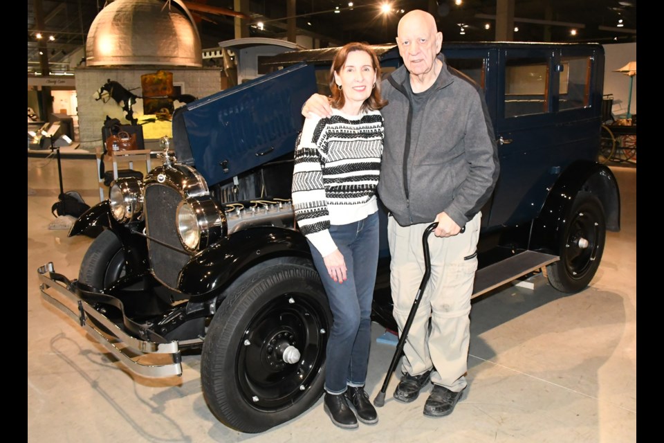 Winnipeg residents Darlene Hildebrand and Steve Van Vlaenderen stand in front of a rare 1920s Derby vehicle at the Western Development Museum in Moose Jaw. Van Vlaenderen has been researching the vehicle and plans to include pictures of it in a book about vintage autos. Photo by Jason G. Antonio
