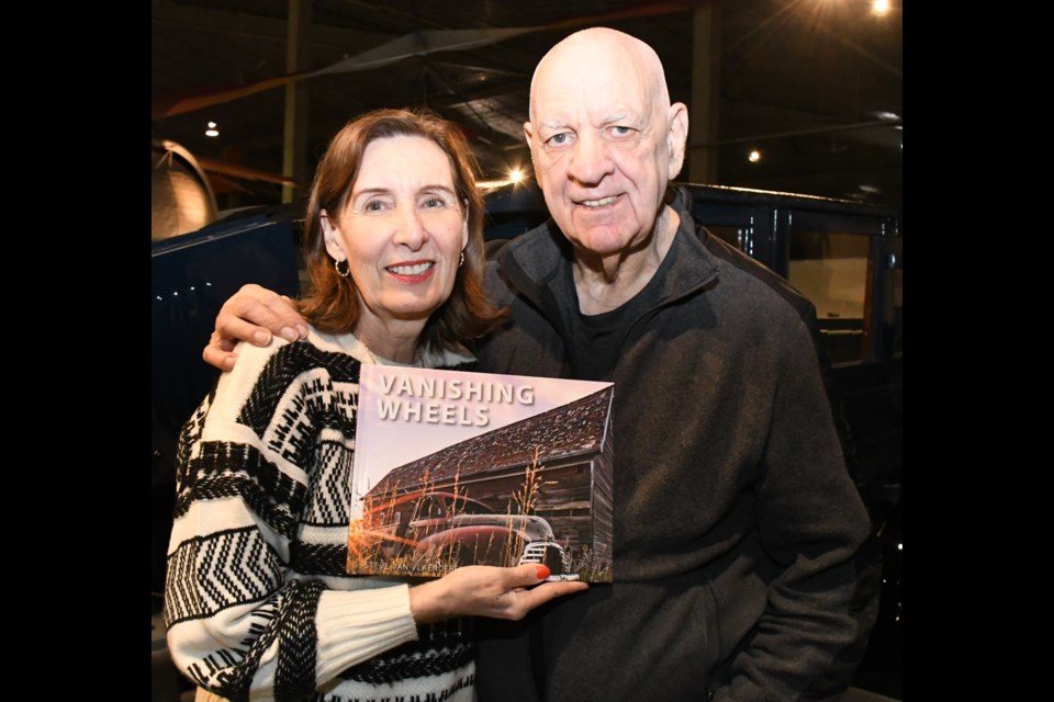 Darlene Hildebrand and Steve Van Vlaenderen display the book "Vanishing Wheels" that they recently released. The book features pictures of all the derelict cars and trucks they found sitting in fields across Western Canada. Photo by Jason G. Antonio