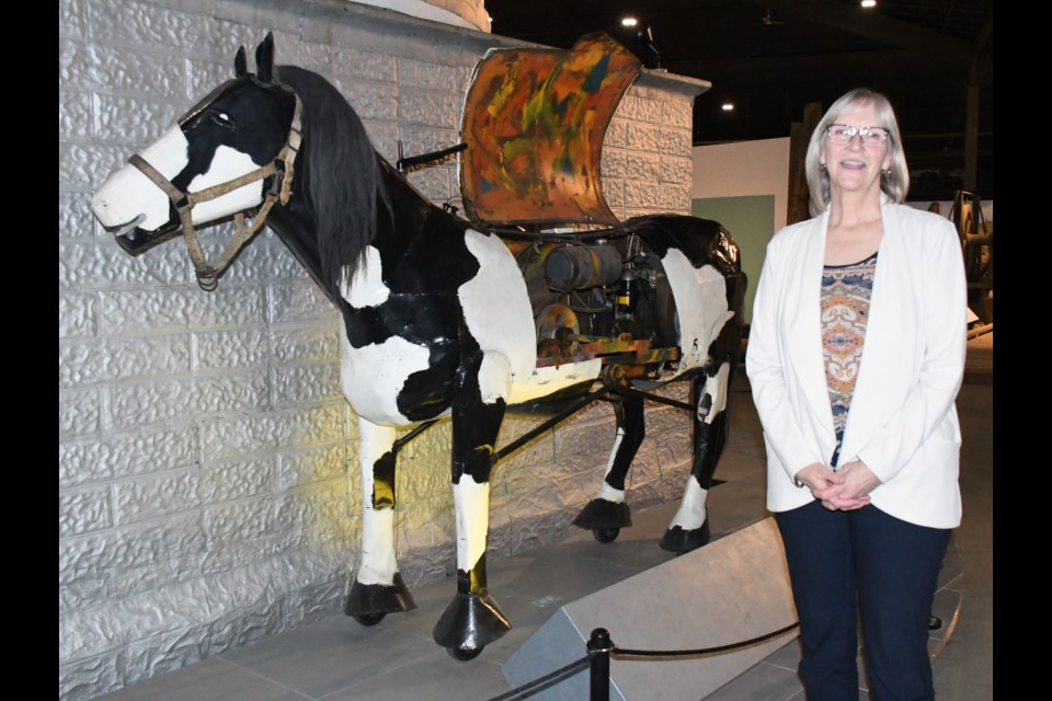Kathy Fitton, the outgoing operations manager at the Moose Jaw WDM, stands next to "Blowtorch" the mechanical horse, one of her favourite artifacts. Fitton has retired after 29 years with the WDM. Photo by Jason G. Antonio
