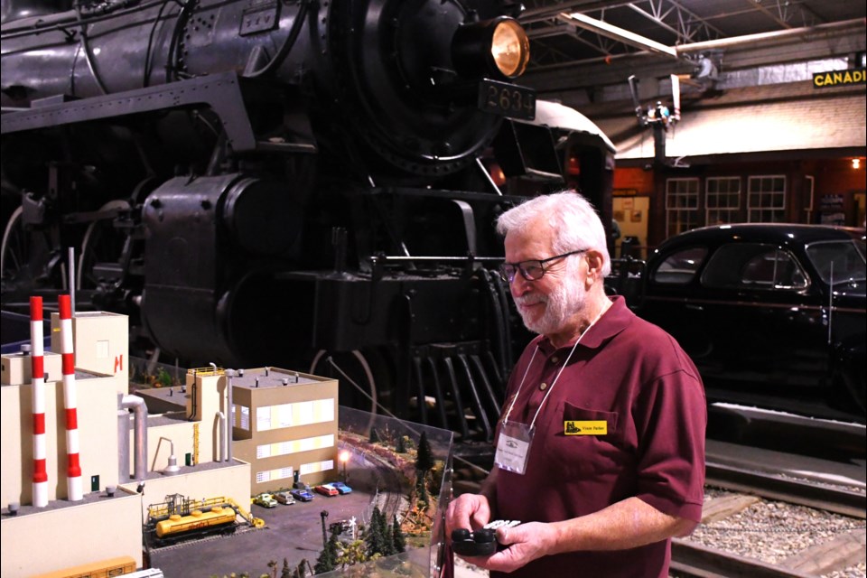 Vince Parker with the River Crossing North Prince Albert Model Railroad Club keeps a watchful eye on his display at the WDM.
