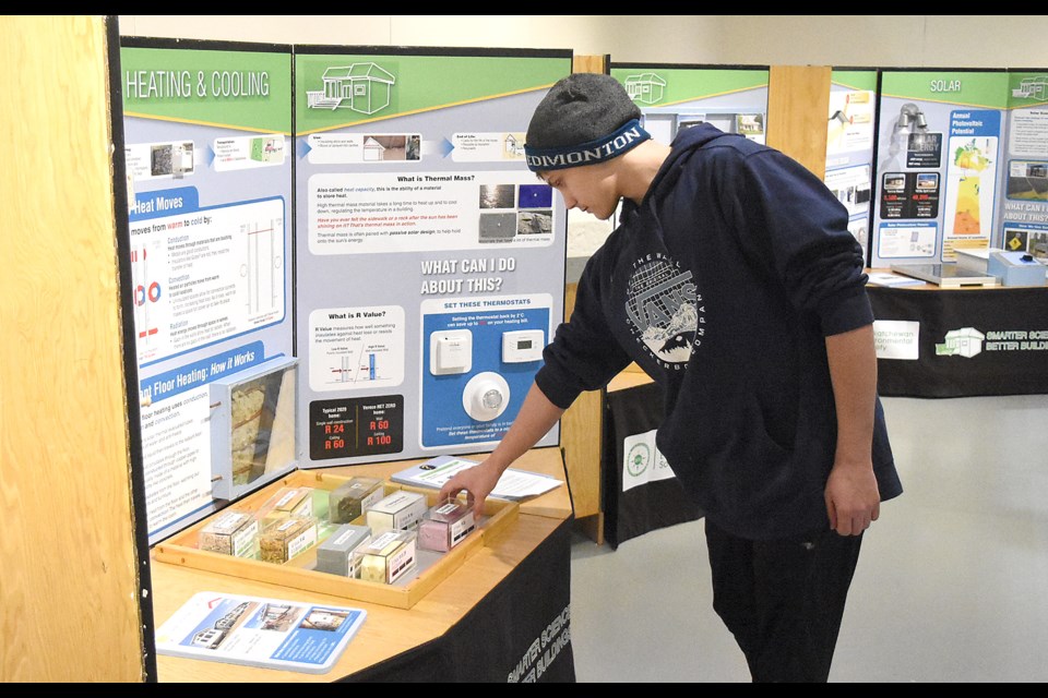 Riverview Grade 11 student Taylor Jacobson checks out a Smarter Science, Better Buildings display during a visit to the Western Development Museum on Saturday afternoon.