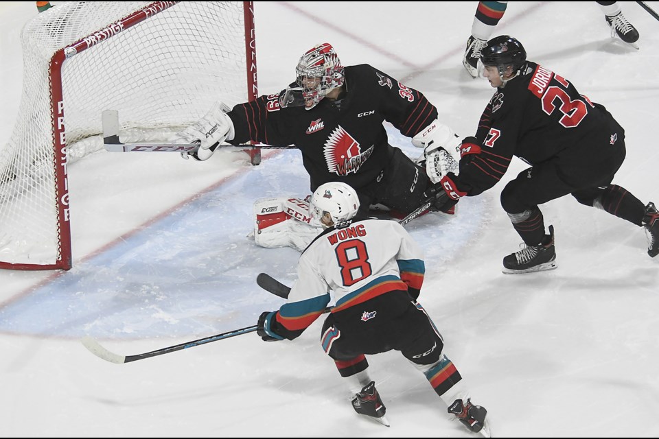 Adam Evanoff scrambles back into position after making a save.