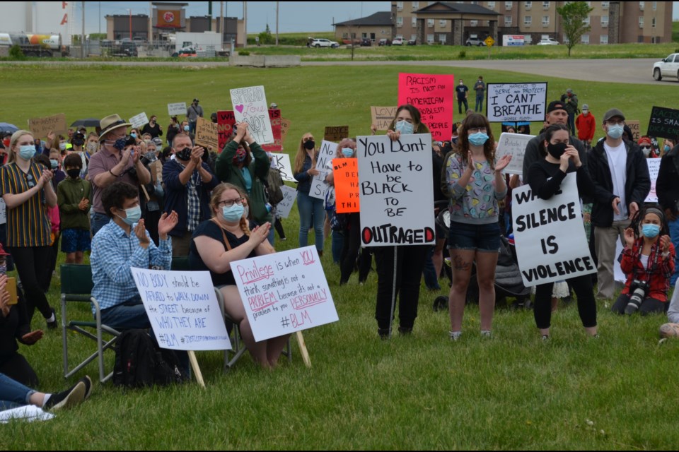 Participants of all ages hold up signs during an anti-racism rally in Innisfail on June 13. Hundreds of people attended the event, which included speeches from organizers and dignitaries.
Dan Singleton/MVP Staff