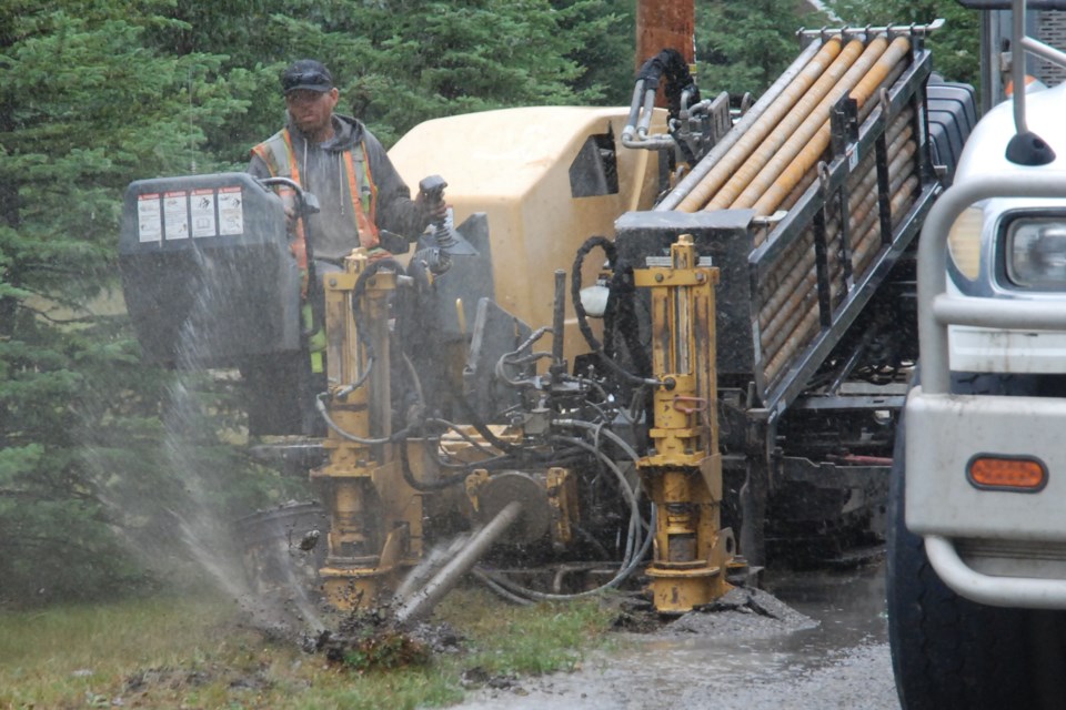 A construction crew with Lethbridge-based contractor Cross Cut Directional Boring was hard at work on Tuesday, Aug. 17 in Sundre on the east side of the Red Deer River despite the rain, which didn’t particularly seem to hamper the progress to deploy high speed broadband fibre optic internet. 
Simon Ducatel/MVP Staff