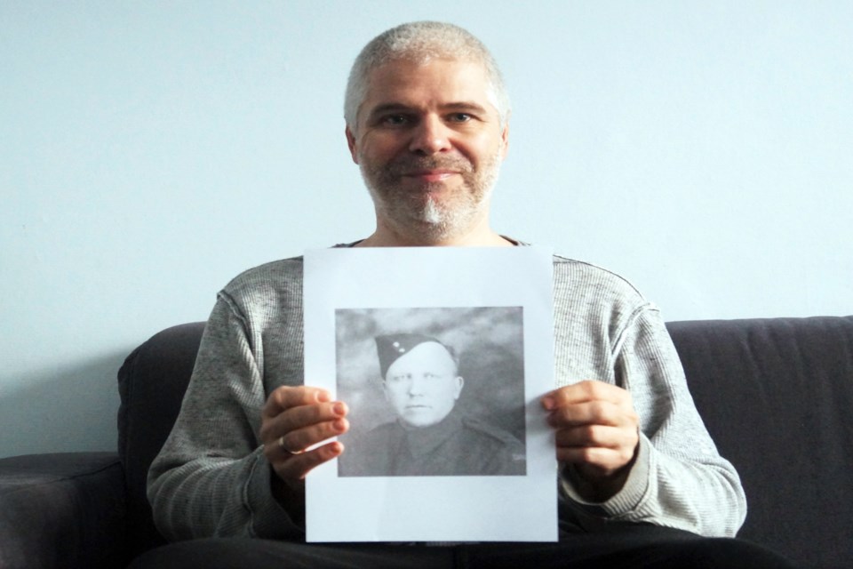 Belgian military researcher Niko Van Kerckhoven proudly holds up the photo of Bowden's Sgt. Norman Walter Gilliland, which he has been searching for since 2015. Submitted photo