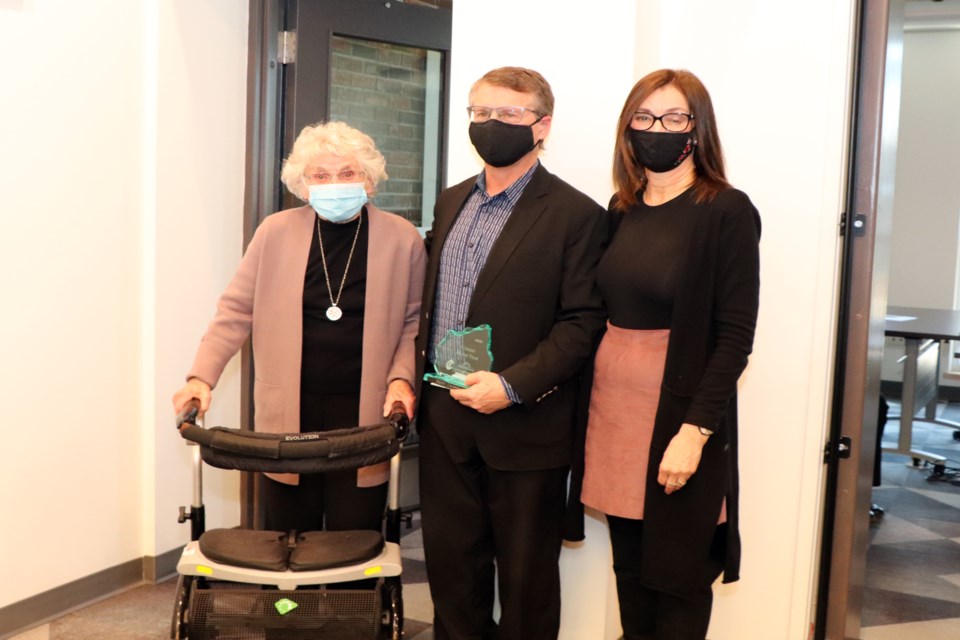 Brent Jackson with his Citizen of the Year Award, and his mother Pat and wife Liana who joined him at the town hall ceremony on March 8. Johnnie Bachusky/MVP Staff