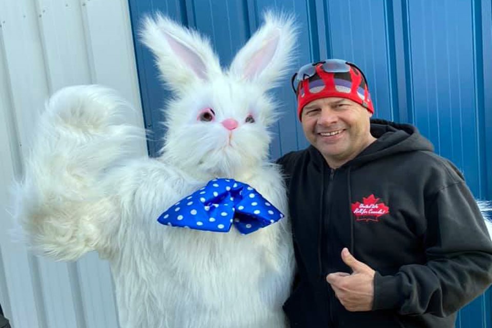 Innisfail mayoralty candidate Glen Carritt with the Easter bunny for his First Annual Spring Fever event on April 3. According to Carritt the two-hour outdoor event attracted more than 400 people. The RCMP and AHS are investigating to determine if the event violated provincial COVID-19 restrictions. Facebook photo