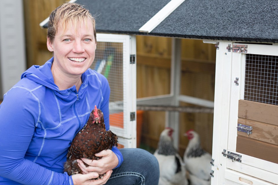 Innisfailian Lisa Reid with her pet chickens in 2018 during her quest to have them legalized in town. Two and half years later, she might be able to have her beloved urban chickens again. File photo/MVP Staff