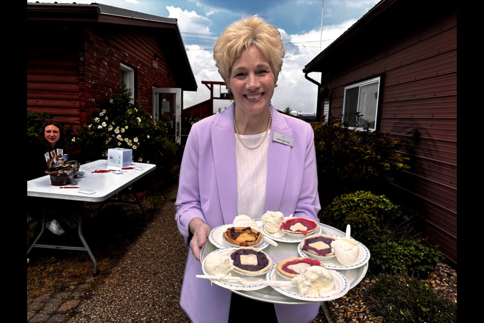 A radiant Mayor Jean Barclay with a tray of Jungle Farm pies and ice cream is ready to serve seniors at the 47th annual Mayor's Garden Party at the Innisfail and District Historical Village. Johnnie Bachusky/MVP Staff