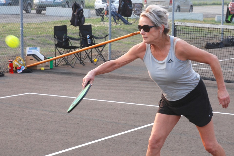 Sundre resident Tanya Trottier demonstrates some good form with a backhanded return on Friday, July 23 during some casual games at the new pickelball courts behind the Sundre High School.
Simon Ducatel/MVP Staff