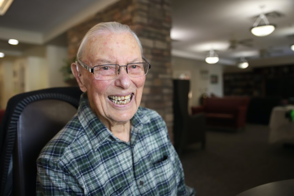 103-year-old Bill Evans shares a joke during an interview in Mount View Lodge in Olds.
