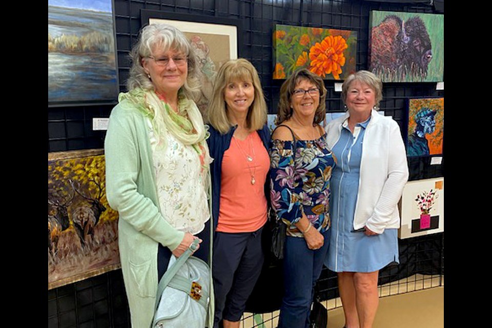 Four Innisfail Art Club artists submitted their work at the ACACA Art Show & Sale in the Sylvan Lake Community Centre on May 10 and 11. From left to right are Carol-Lynn McKinnie, Rhonda VanVlaanderen, Laurie Miller, and Iris White. Submitted photo