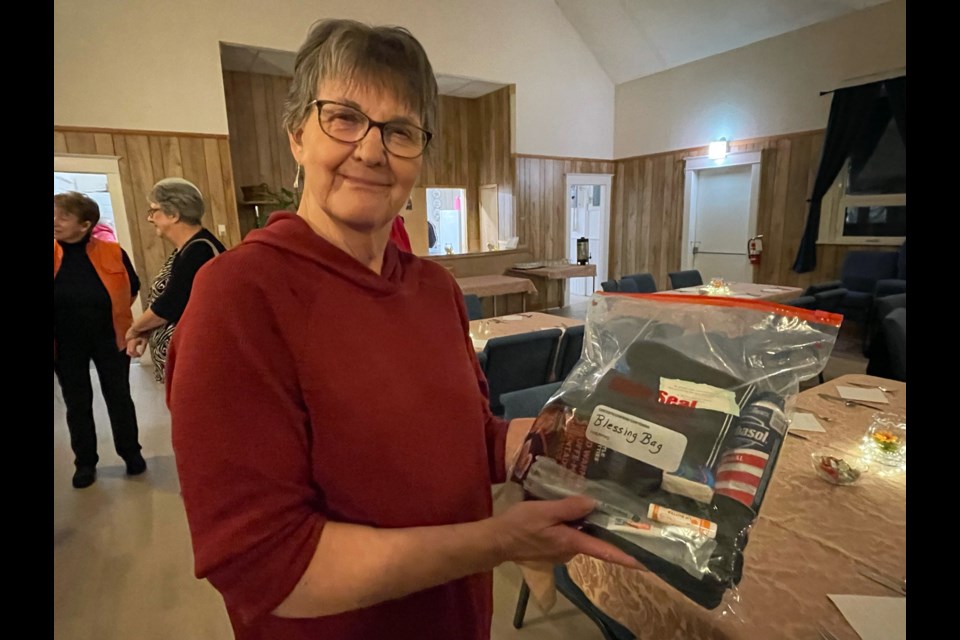 Hazel Ray, the new people’s warden at Innisfail's St. Mark’s Anglican Church, with one of the 50 Blessing Bags that were created for The Mustard Seed in the City of Red Deer to hand out to vulnerable men and women. Johnnie Bachusky/MVP Staff