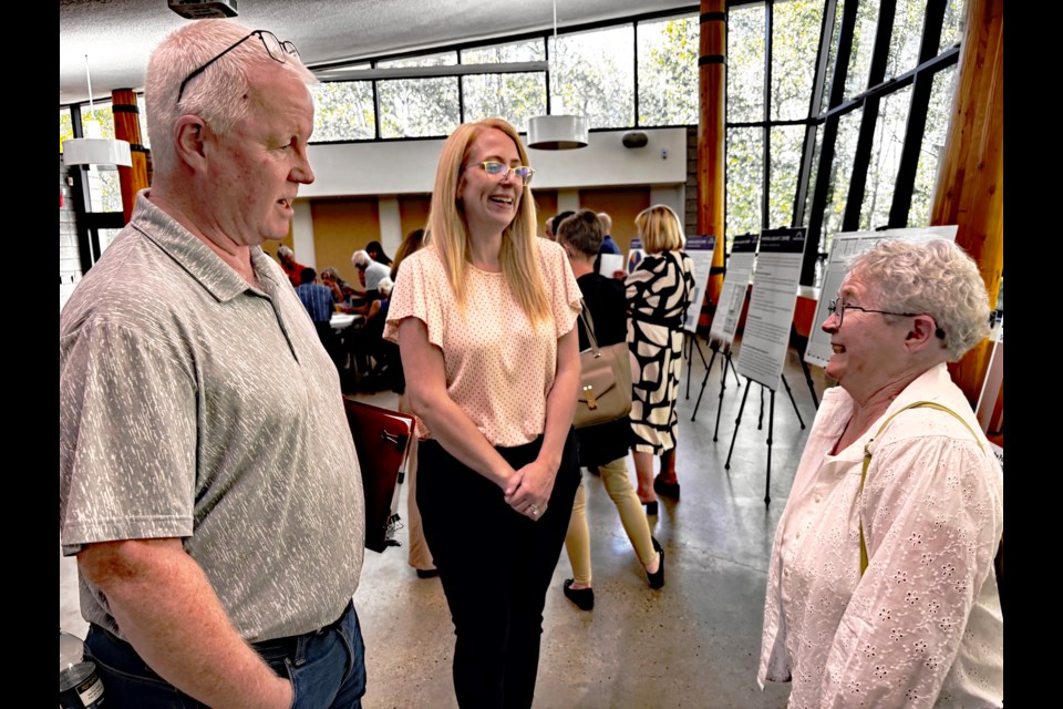 Jim Carroll and Mary Fleming (right), attendees at the first open house on Aug. 19 for the modernization of the Innisfail Aquatic Centre, share a light moment with Erica Vickers, director of corporate services for the Town of Innisfail. Johnnie Bachusky/MVP Staff