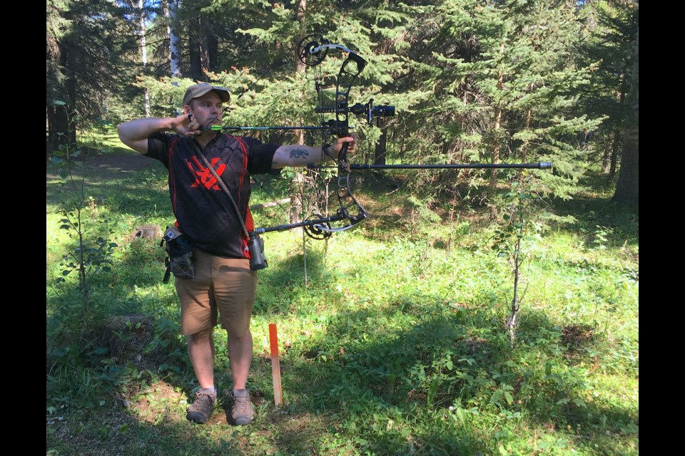 Marcus "Muc" Simons, from Regina, carefully lines up a shot after drawing an arrow on Saturday, Aug. 13 during the Archery Shooters Association Classic Tournament that was hosted by the Elk Ridge Archery Club at an outdoor venue south of Sundre called Painted Warriors. 
Simon Ducatel/MVP Staff