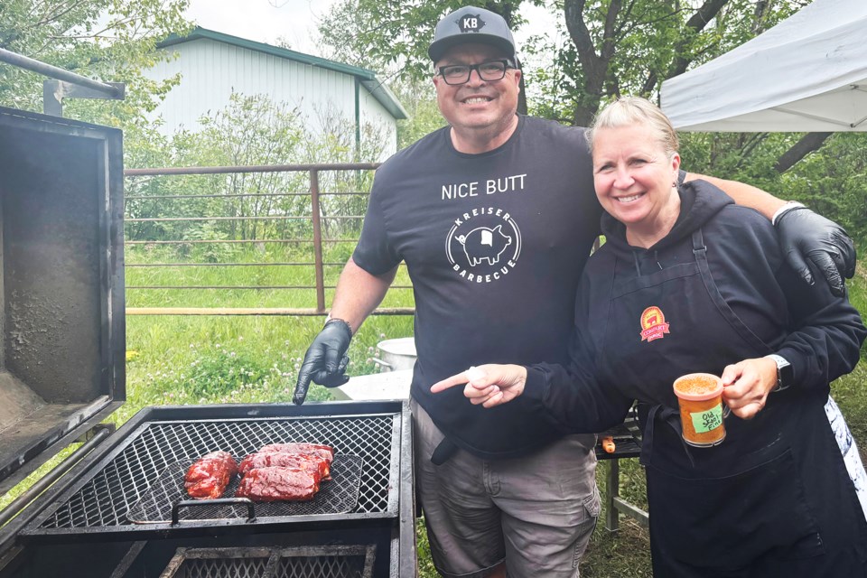 Barry Kreiser and wife Lana cooking up a storm during the Kansas City Barbeque Society-sanctioned event north of Didsbury on Sunday, July 27.