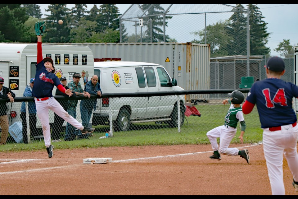 A Ponoka Bulls base runner successfullly takes third base during a consolation final game against the Innisfail Hawks on July 27 during the three-day 2025 Provincial U11 AA Tier 6 championship tournament held in Innisfail from July 25 to 27. Johnnie Bachusky/MVP Staff