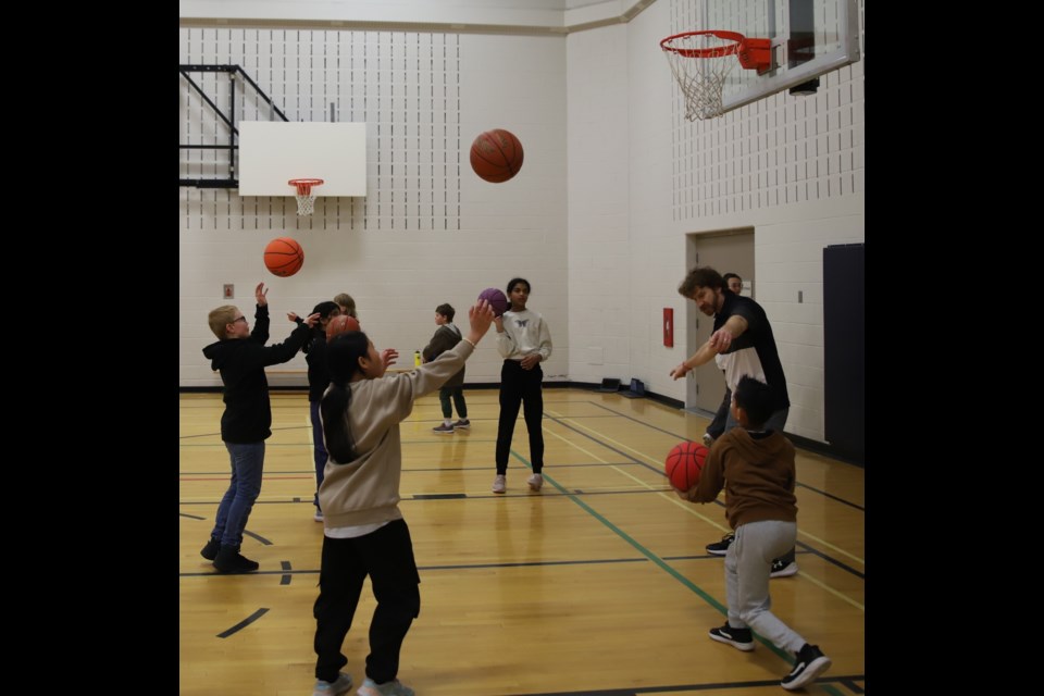 Students at Holy Trinity Catholic School participate in Around The World, a basketball drill organized by teacher Kyle Young, one of the creators of the Olds Hoops Lab, an eight-week basketball camp in Olds that begins March 10.
Doug Collie/MVP Staff