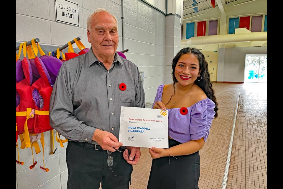 Gavin Bates presents Rosa Waddell Huaripata the certificate for being the Innisfail winner of the 2023 Bates Wardle Award at the Innisfail Aquatic Centre on Nov. 2. Johnnie Bachusky/MVP Staff