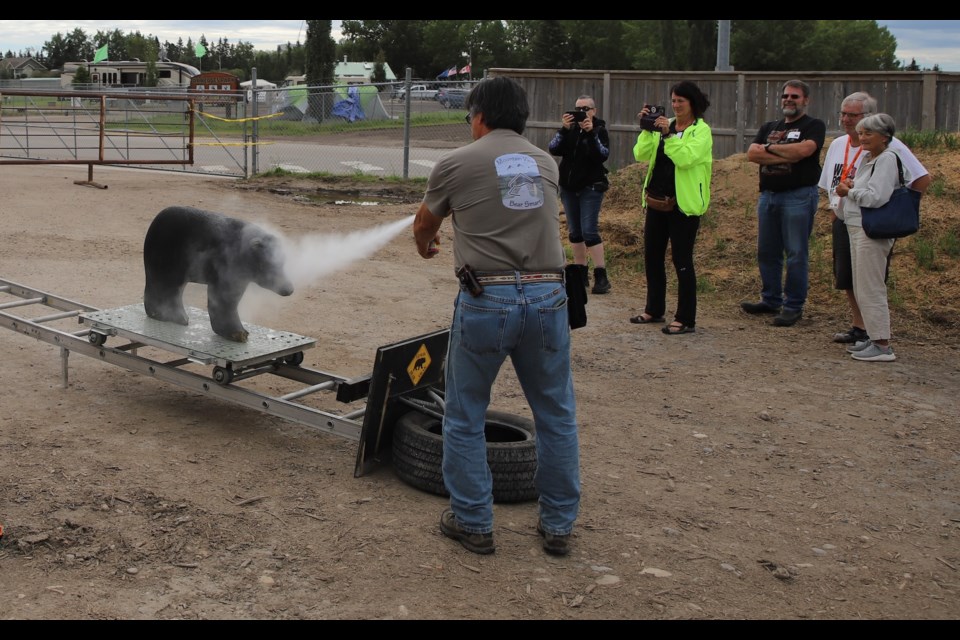 Paul Fraser of Mountain View Bear Smart shows attendees how to properly fire bear spray at an approaching bear.
Doug Collie/MVP Staff